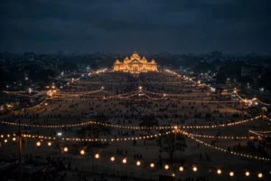 AI-generated image — wide night view of a Durga Puja festival ground in Kolkata with the illuminated pandal and crowds in the distance (no real persons)